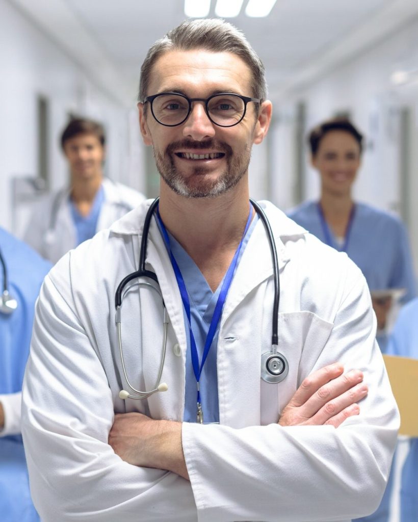 diverse-medical-team-of-doctors-looking-at-camera-while-holding-clipboard-and-medical-files.jpg